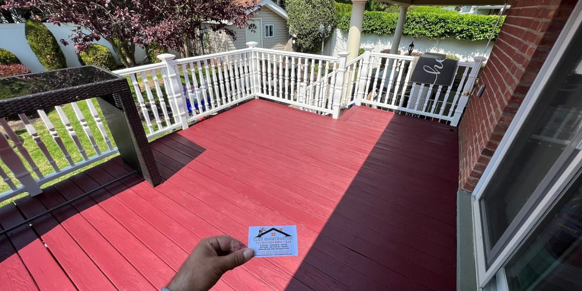 Beautifully lit custom deck with LED and string lights by Eled Decking Long Island